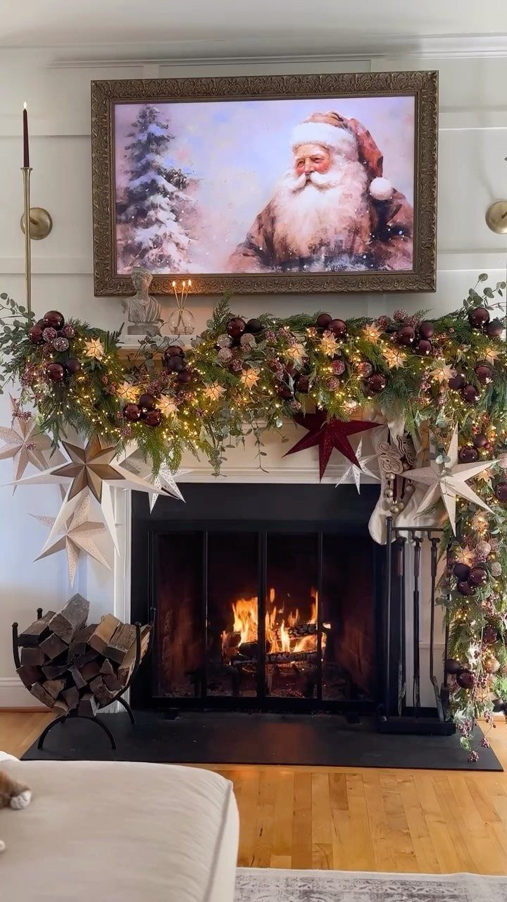 Decorating for Christmas: 12 Ideas That Work in Real Rooms 1 Green garland with fairy lights and star ornaments decorating a white fireplace mantel above a burning fire.