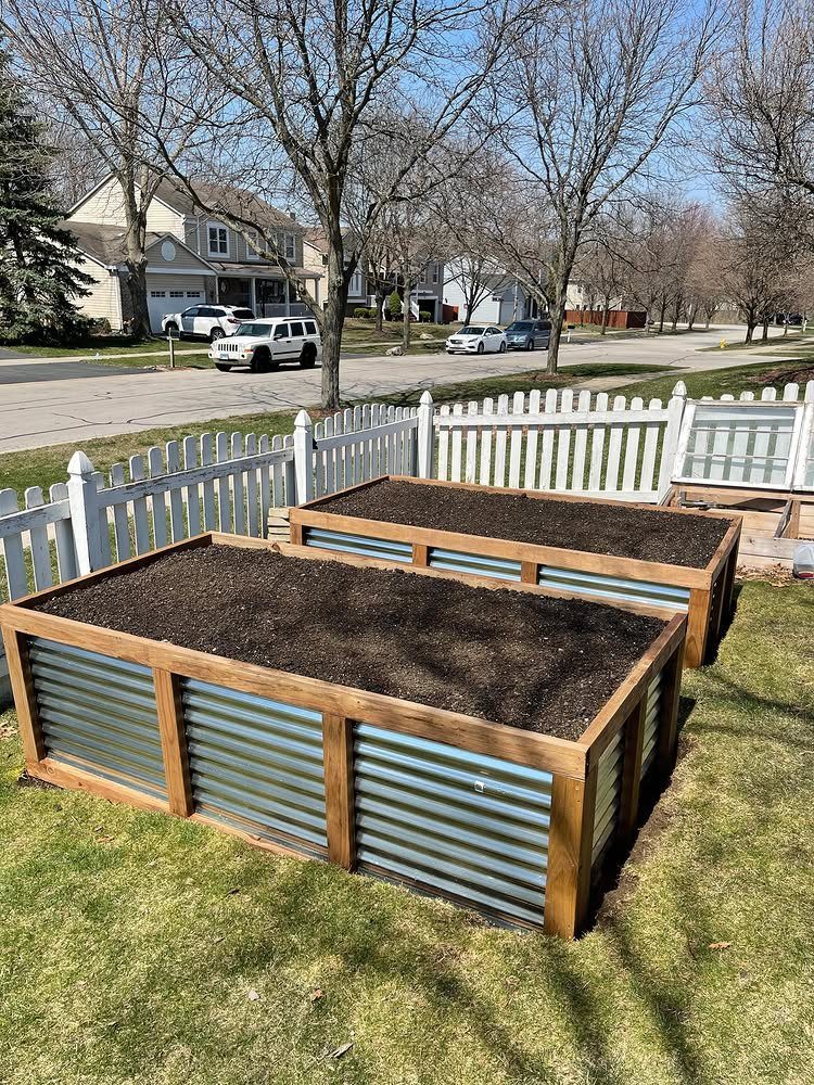 7 Vegetable Garden Box Ideas for Every Backyard Space 7 Two raised garden beds with wooden frames and corrugated metal sides filled with dark soil.